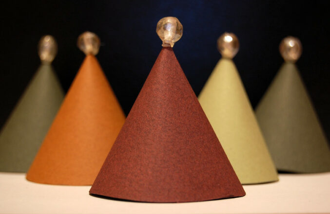 Change Biased Business Words: Image is paper cones of different colors.