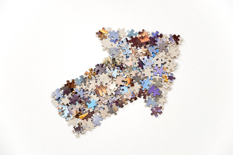 Initial Negative Reaction: Image is arrow made of up jigsaw puzzle pieces.