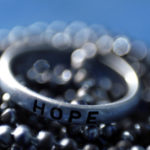 Customer Experience Leadership: Image is round band with the word hope on it.