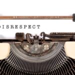 Disrespect People: Image is the word disrespect typed on a manual typewriter.
