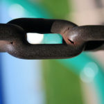 Leaders Break Free of Old Beliefs: Image is iron links in a chain