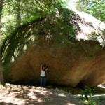 Leadership Unfairness: Image is giant boulder w/ person standing underneath.