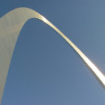 Leading Volunteers: Image is arch in a blue sky.