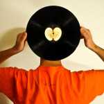 Listening Excellence: Image is Man w/ Record Album w/ ears in the middle.