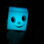 Negative Effects of Being Positive image is Smiley Face Cube Glowing