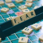 Presuming Fear: Image is Scrabble Tiles Spelling Fear