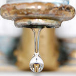 Trivial Customer Service Actions: Image is gold faucet drip looking like pendant.
