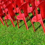 Business Lessons Learned: Image is many red chairs lined up perfectly.